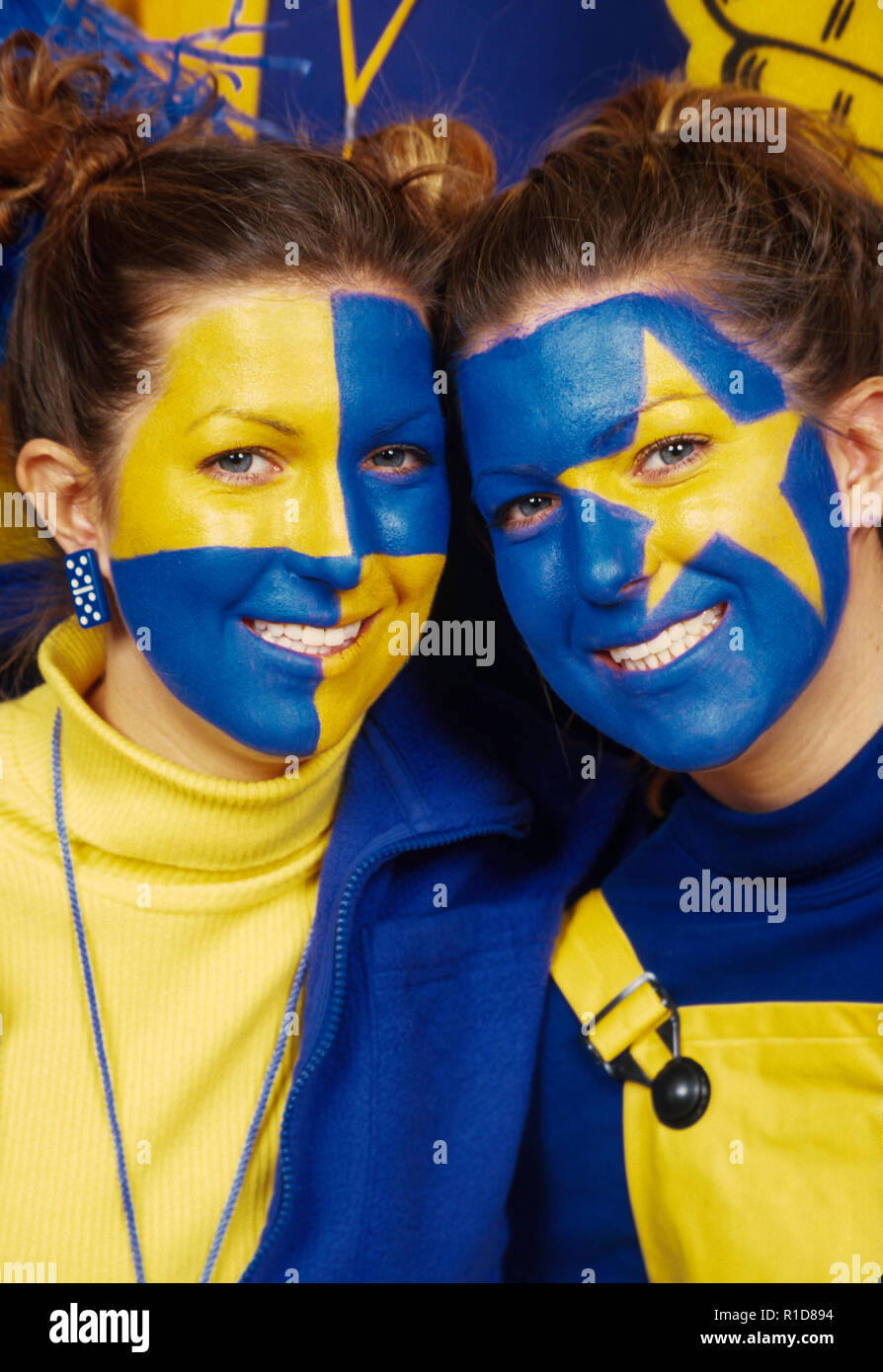 Entusiasti appassionati di sport con facce dipinte in un gioco, USA Foto Stock