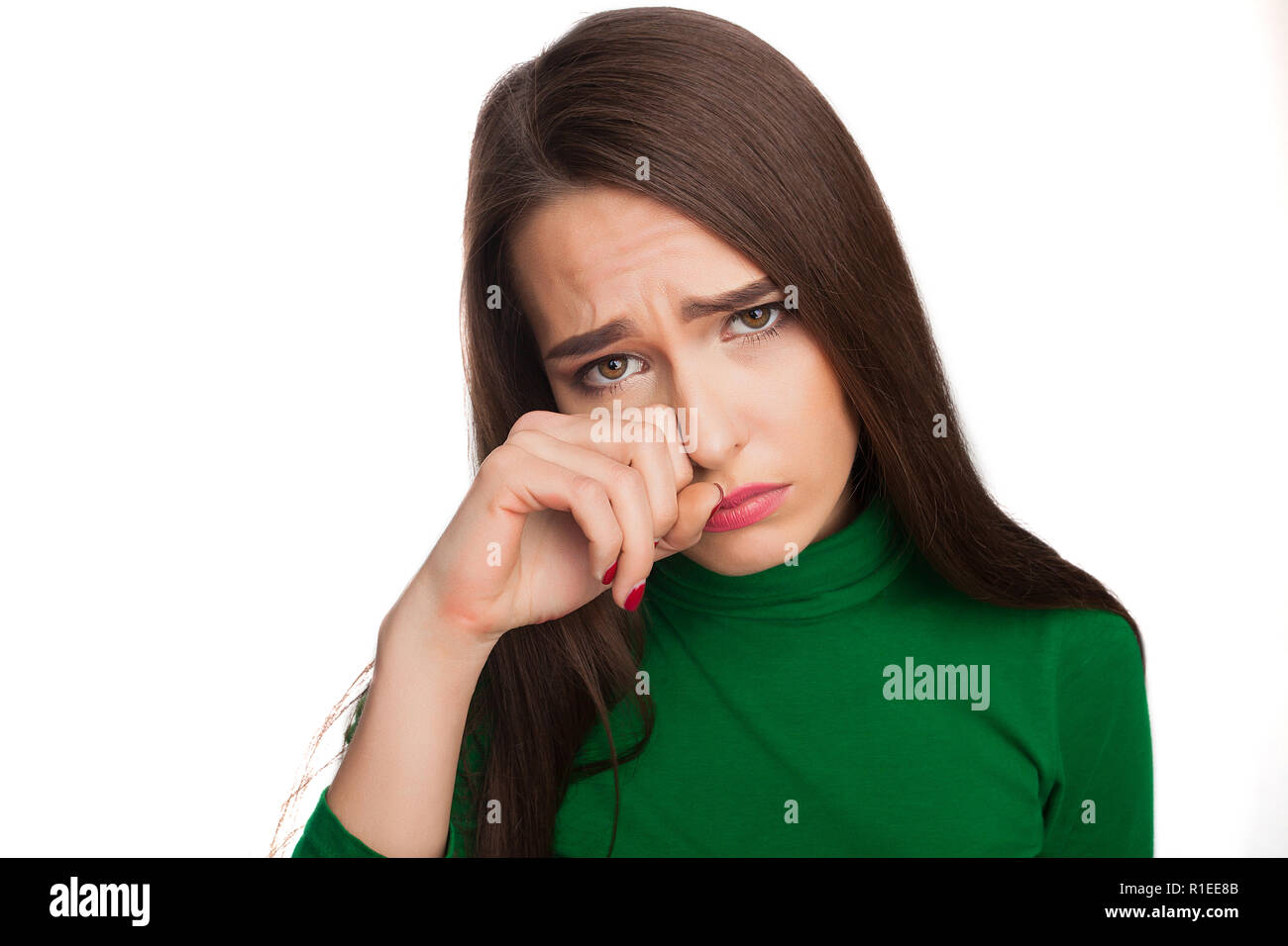 La donna in una verde turtleneck Foto Stock