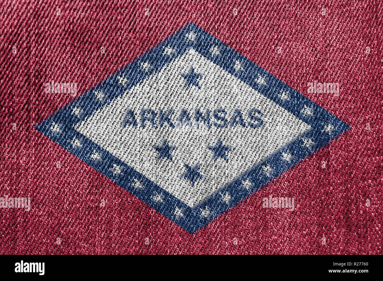 Industria tessile o di politica concetto: Arkansas bandiera Jeans Denim Texture di sfondo Foto Stock