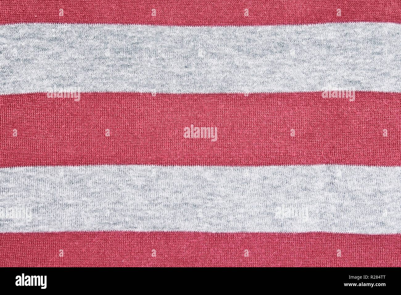 Lavorate a maglia rosso-grigio a strisce di tessuto di sfondo texture Foto Stock