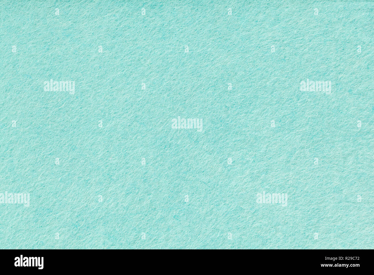 Turchese chiaro sfondo opaco di tessuto scamosciato, primo piano. Texture  di velluto di seamless verde feltro di lana Foto stock - Alamy