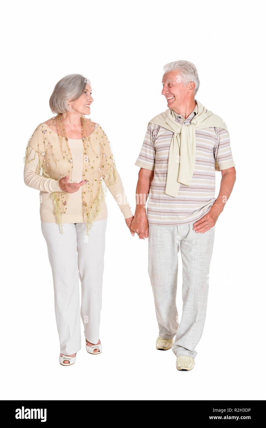 Ritratto di coppia senior tenendo le mani su sfondo bianco Foto Stock