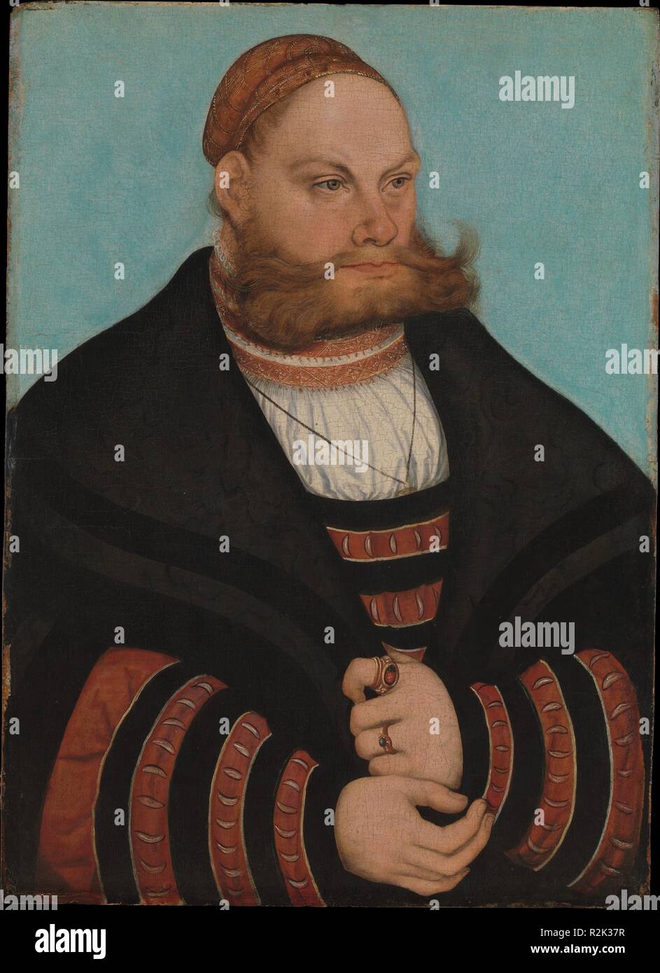 Lukas Spielhausen. Artista: Lucas Cranach il Vecchio (tedesco, Kronach 1472-1553 Weimar). Dimensioni: 20 x 14 3/8 in. (50,8 x 36,5 cm). Data: 1532. Il sitter, che indossa il giallo e nero vestito a strisce di membri di alto rango del tribunale elettorale di Sassonia, possono essere identificati con la sigla LS sull'anello sigillo come Lukas Spielhausen, che è stato da 1531 un avvocato nello Stato curia giudiziaria sotto Johann I, la costante. La sua età di circa trenta-nove nel 1532, data della pittura, è compatibile con il sitter's aspetto. La vivace schema di colori e di interazione di curve in co Foto Stock