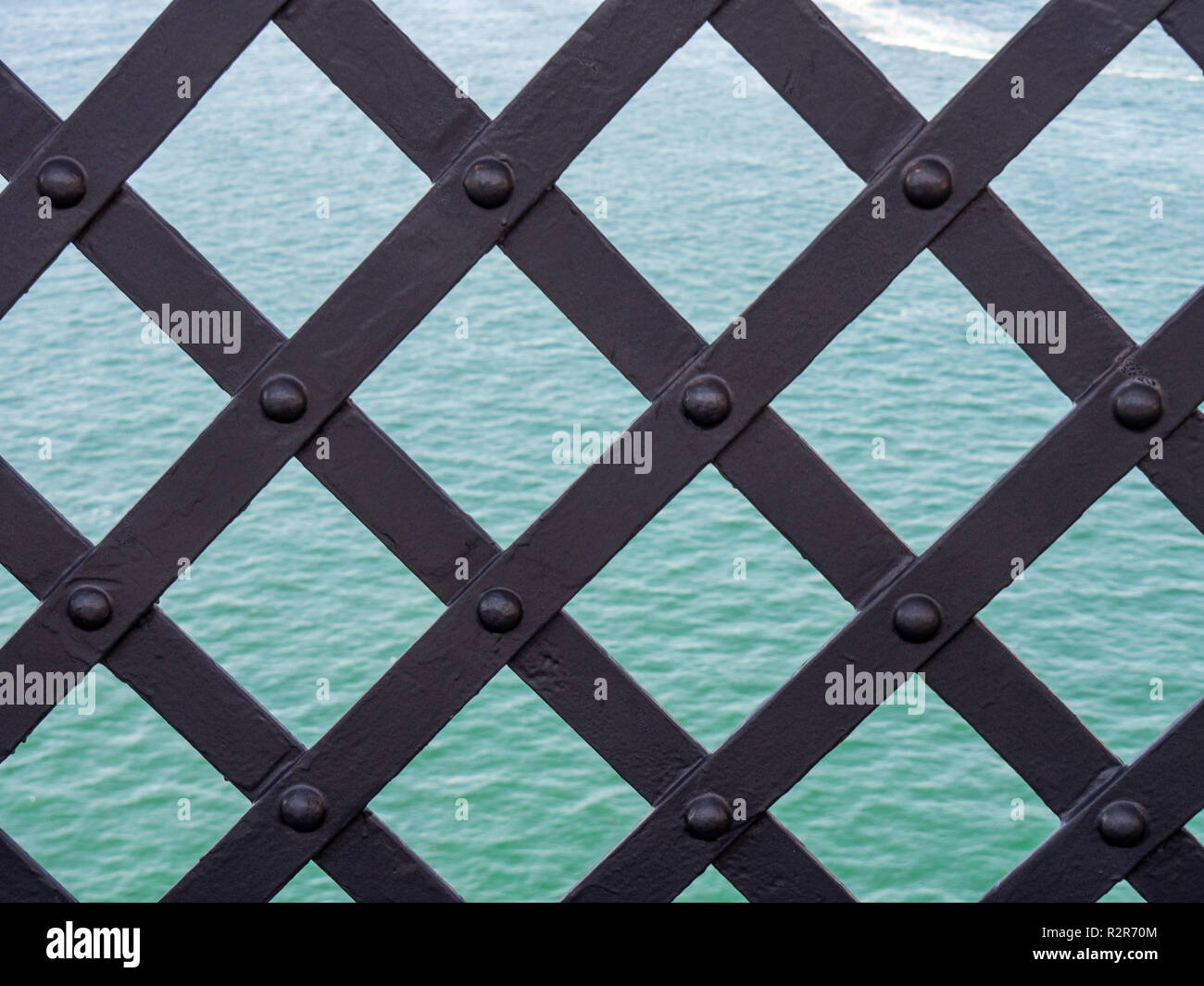 Rivettata reticolo di ferro lavorare sul Ponte del Porto di Sydney NSW Australia. Foto Stock