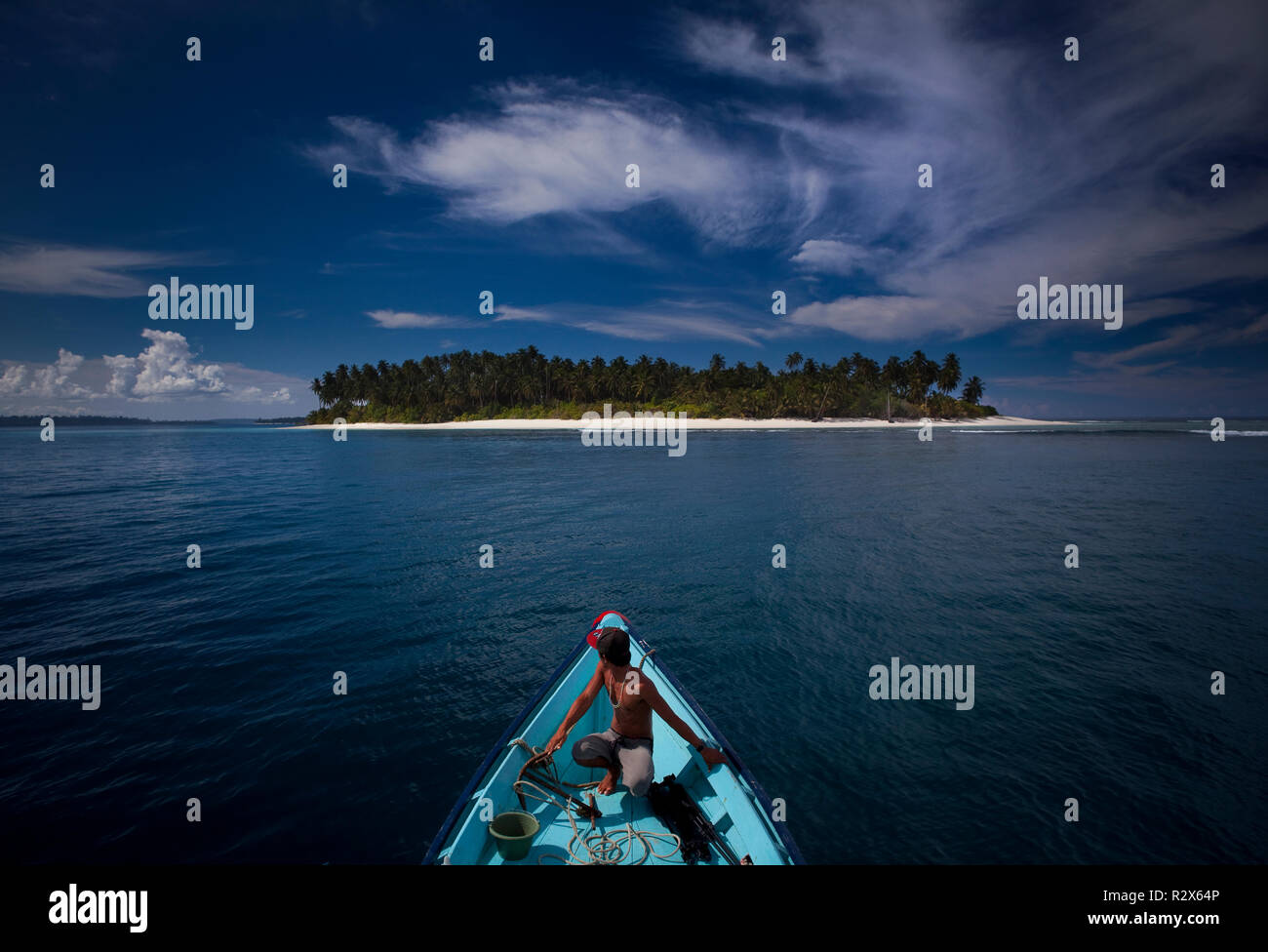 Guida Surf Ibrahim guidare un viaggio a remoto surf break 'John Candy's". Foto Stock