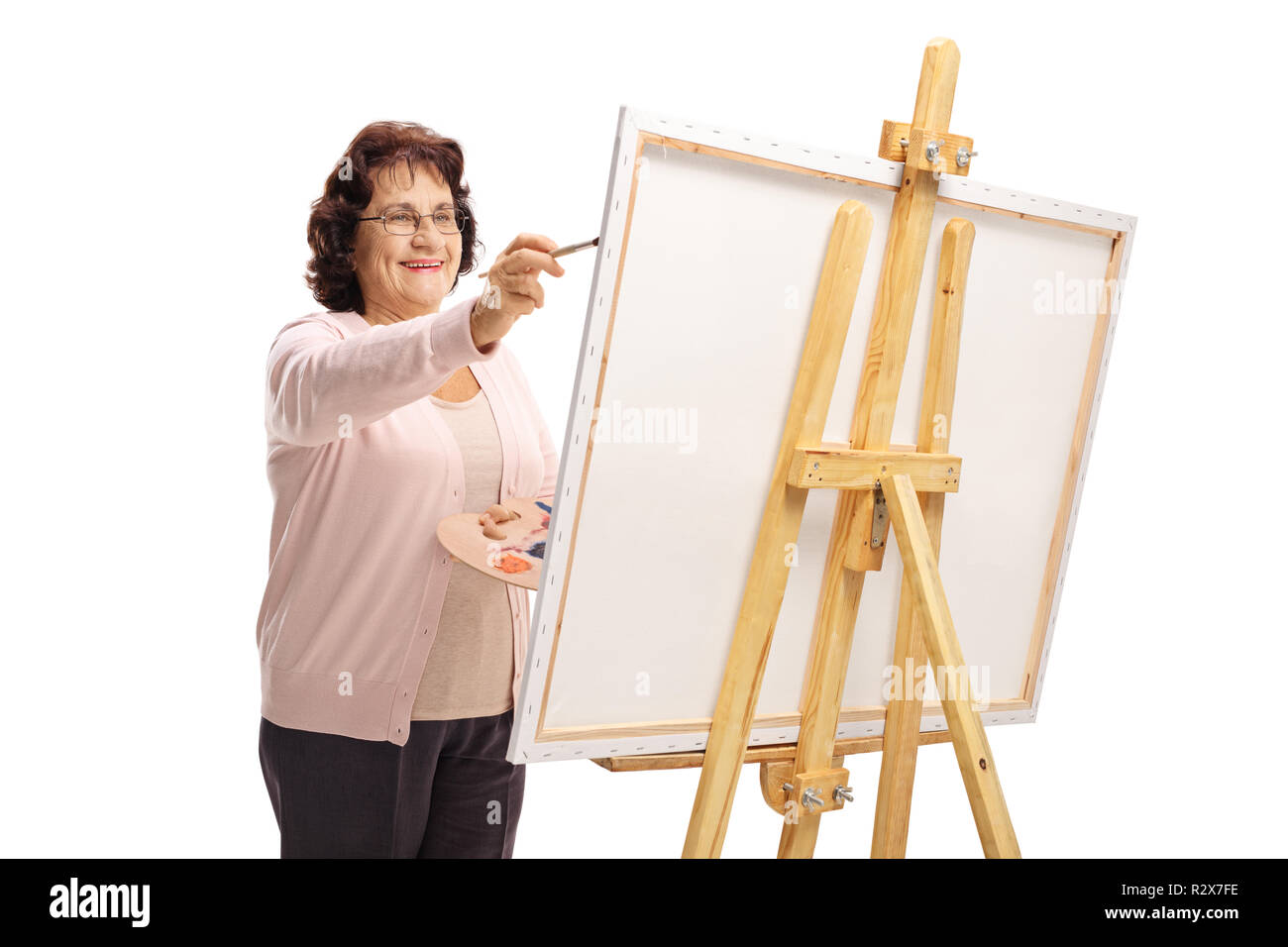 Donna anziana in una pittura su tela isolati su sfondo bianco Foto Stock