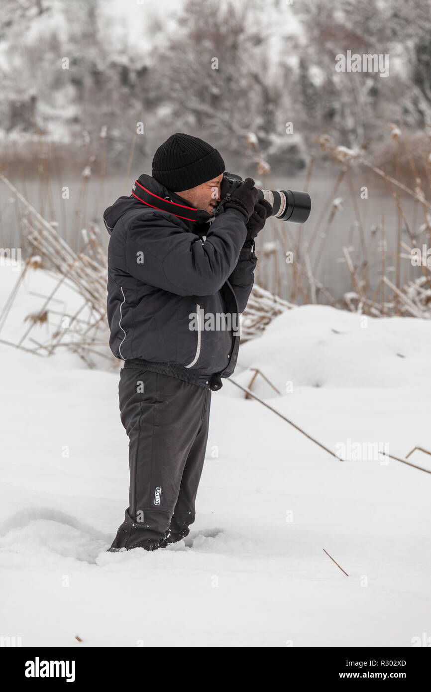 Fotografo nella neve Foto Stock