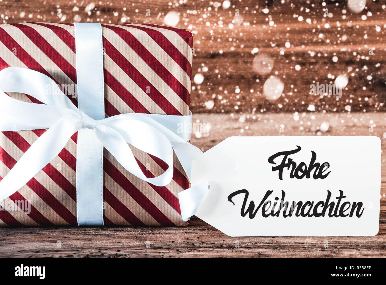 Dono, Calligrafia Frohe Weihnachten significa Buon Natale, i fiocchi di neve Foto Stock