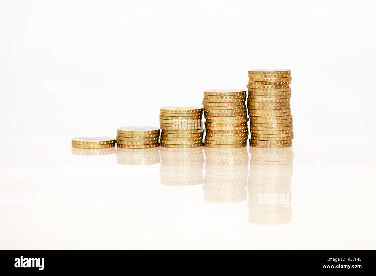 In aumento le monete d'oro Foto Stock