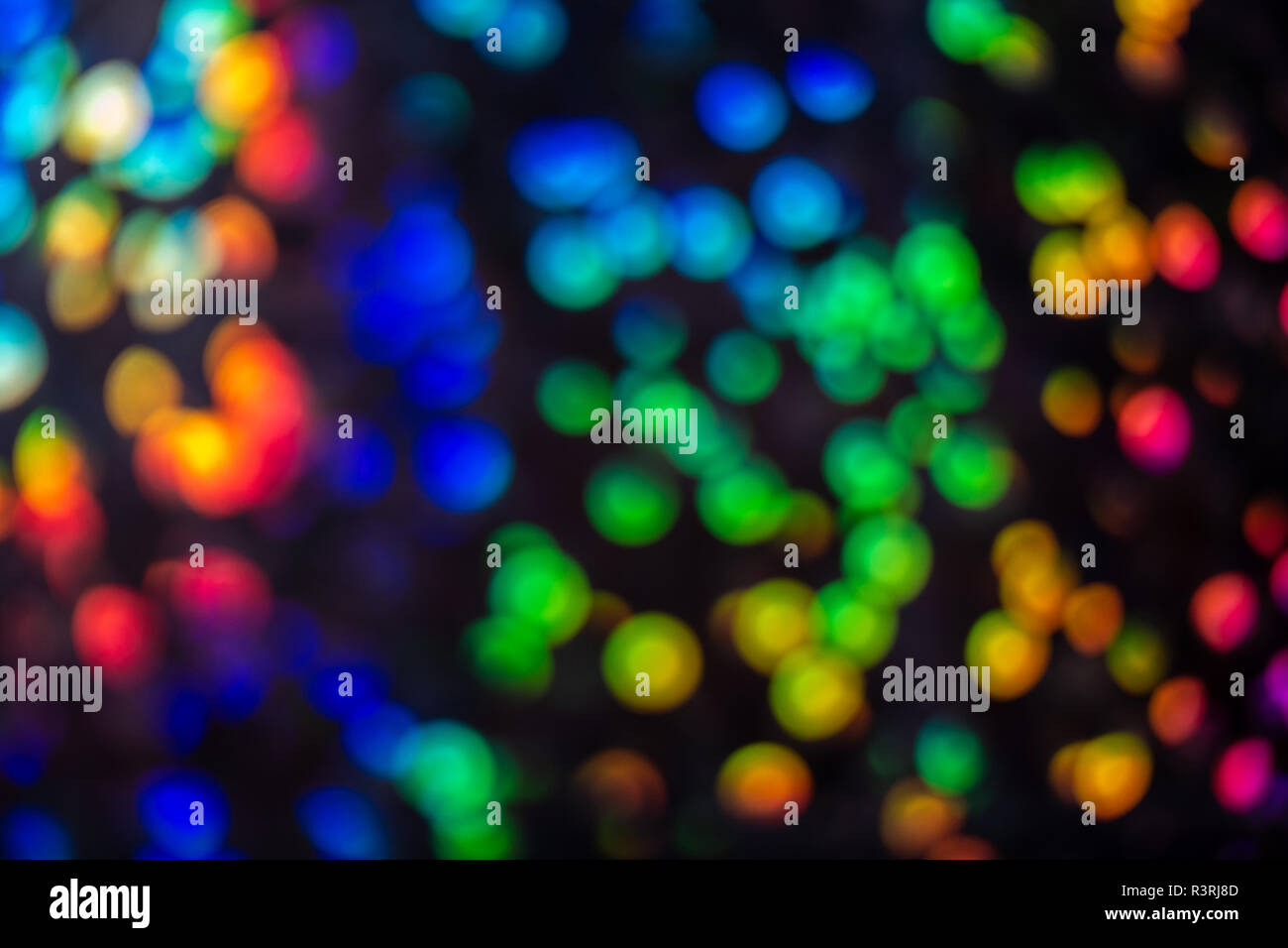 Mulicolored sequined contrasto effetto bokeh di fondo Foto Stock