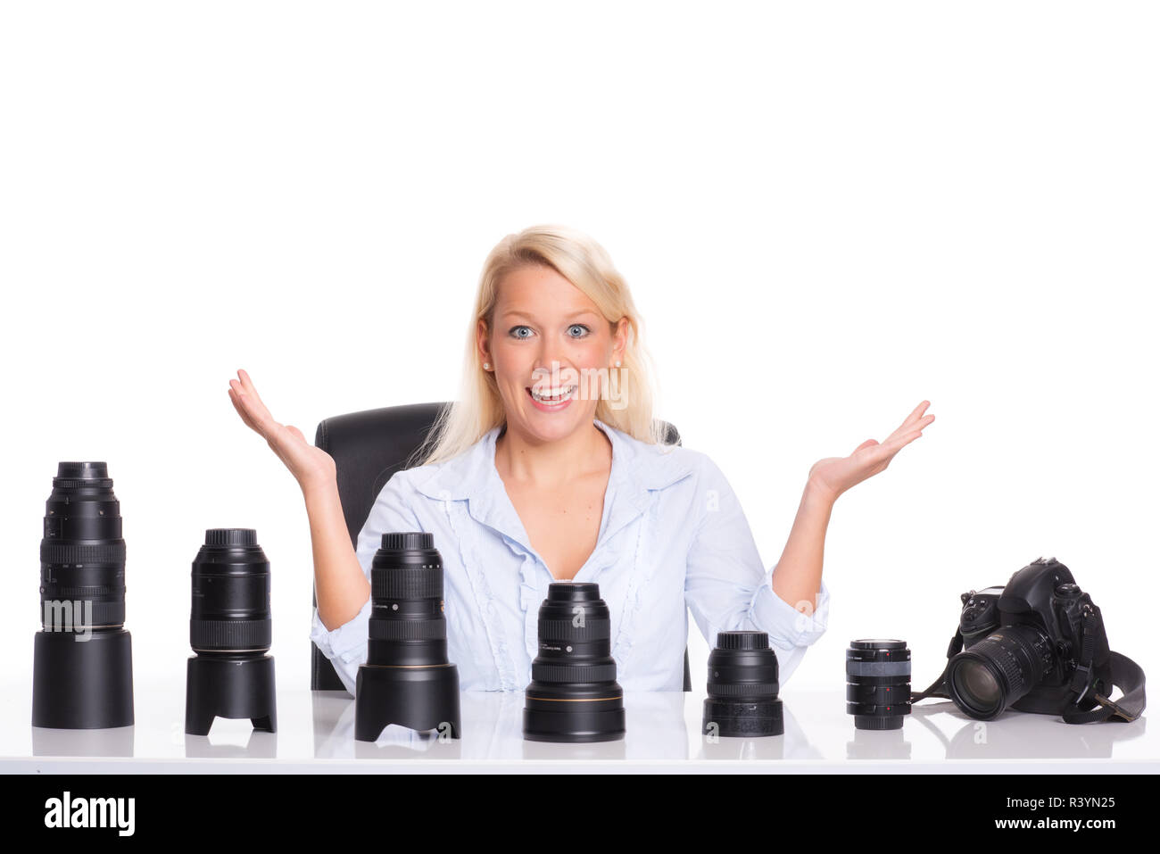 Fotografo presenta diverse lenti Foto Stock