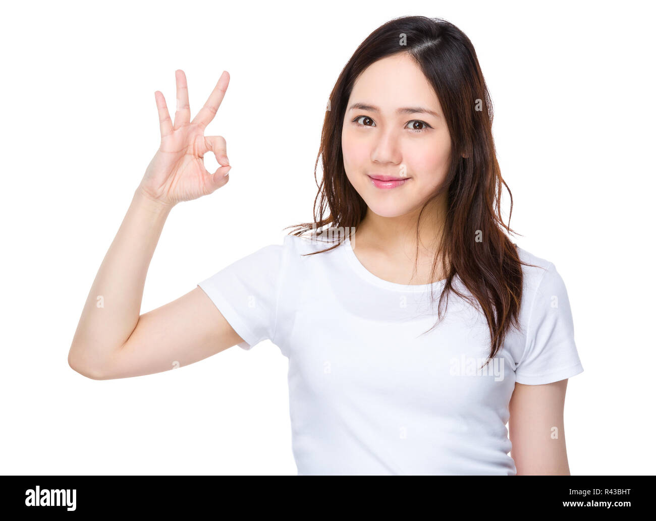 Asian giovane donna con segno ok getsure Foto Stock