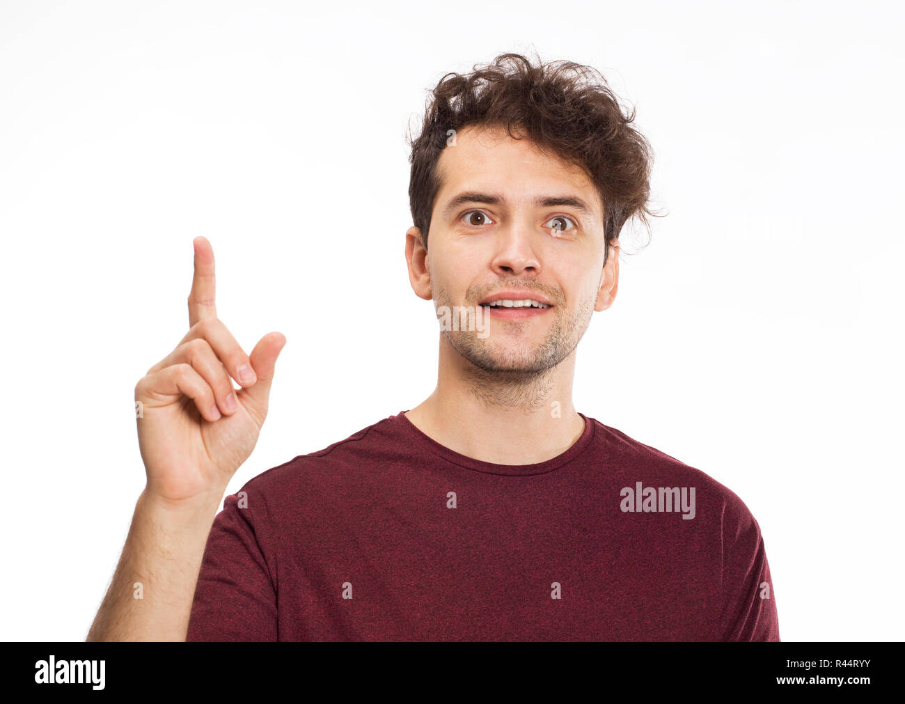 Allegro sorridente giovane uomo ritratto con una buona idea Foto Stock