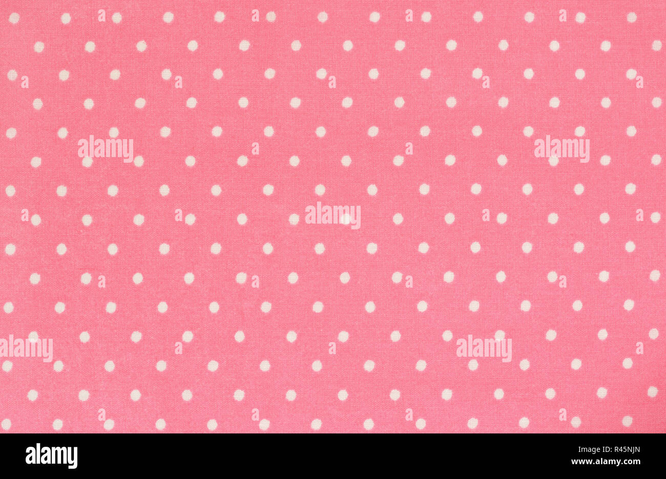 Pink polka dot tessuto per lo sfondo Foto Stock