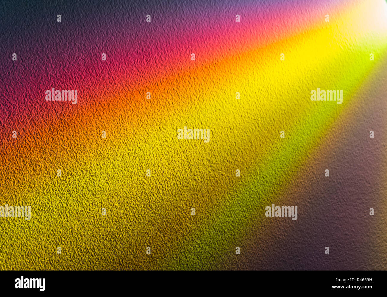 Sullo sfondo di un multi-raggi colorati emanano dall'angolo superiore destro Foto Stock
