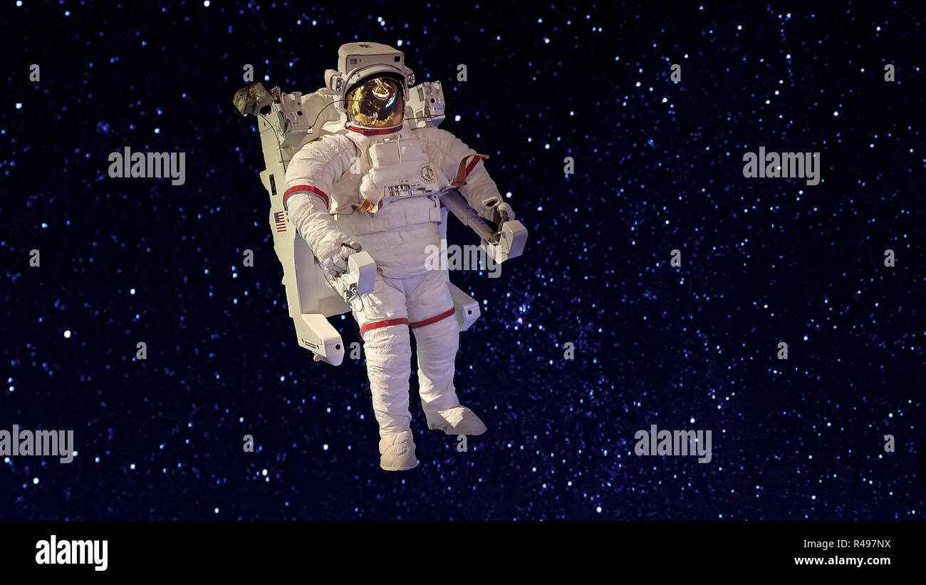 Un astronauta in tuta galleggiante nella nerezza di spazio su uno sfondo di stelle Foto Stock