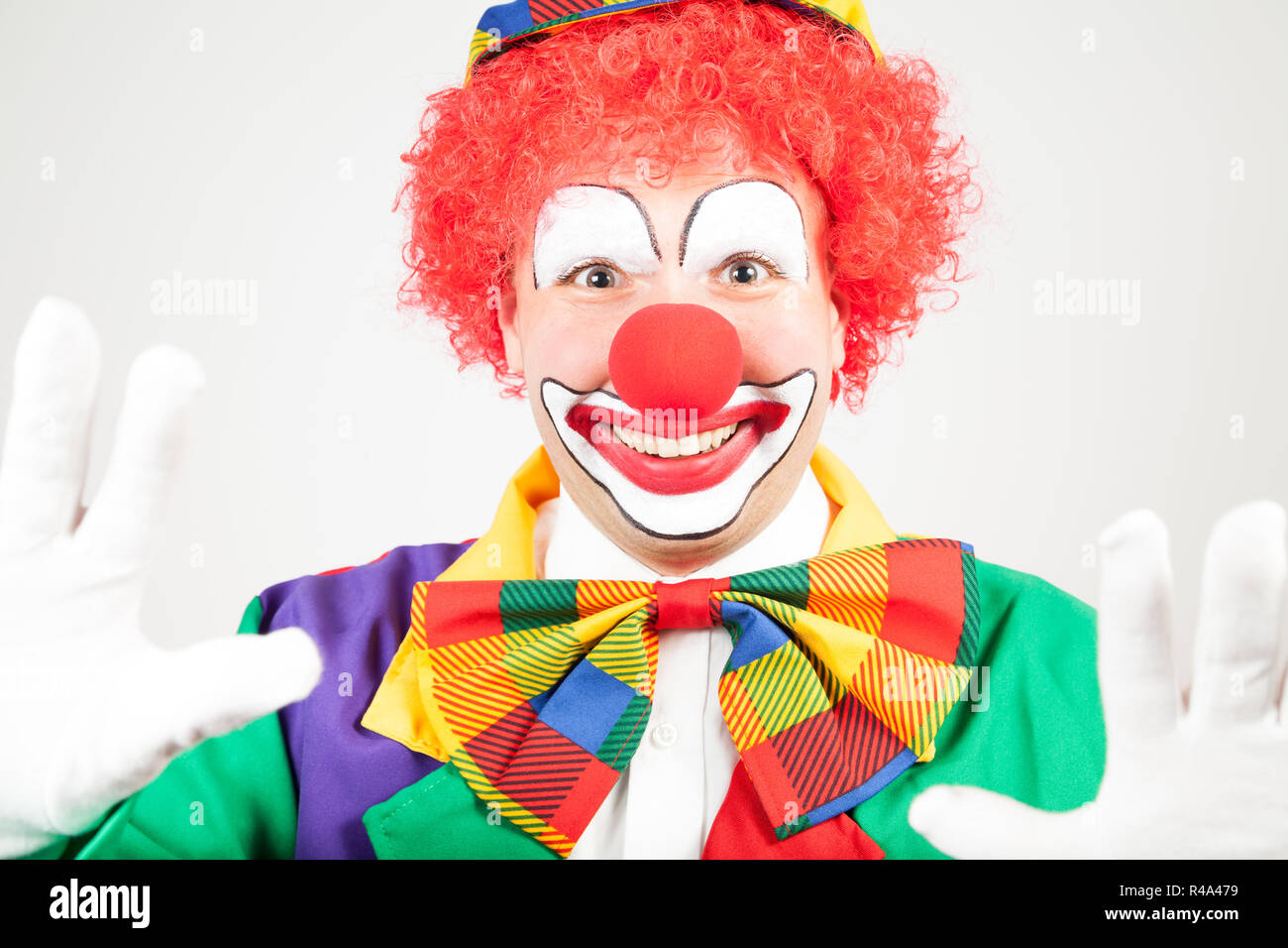 Clown con guanti bianchi Foto Stock