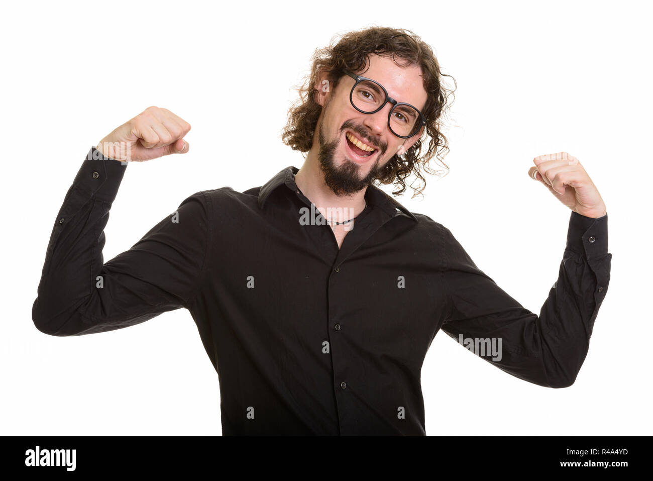 Felice bello uomo caucasico cercando motivati a braccia alzate Foto Stock
