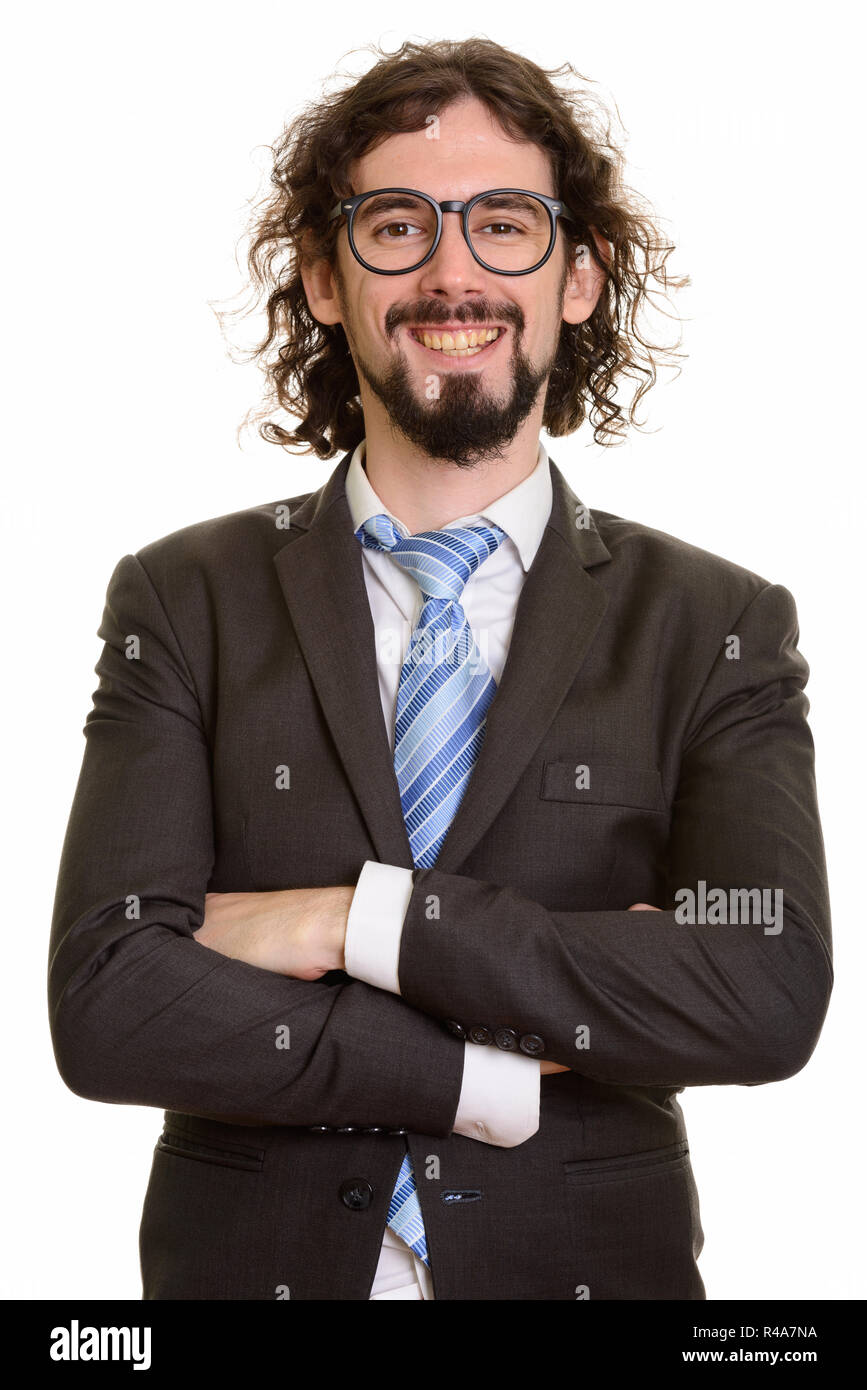 Felice bello imprenditore caucasico sorridente con le braccia incrociate Foto Stock