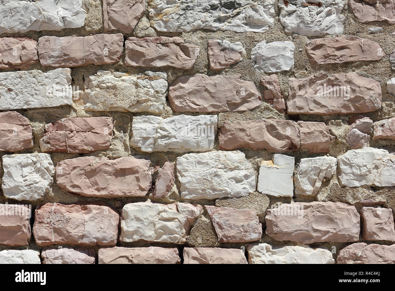 Parete costituita da pietre del Monte Subasio in Italia Foto Stock