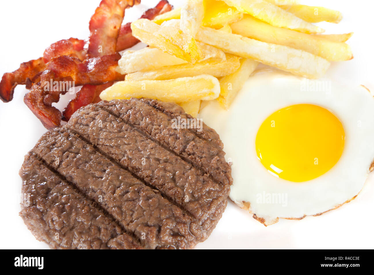 Chiudere il cibo spazzatura con elevati livelli di calorie e colesterolo Foto Stock