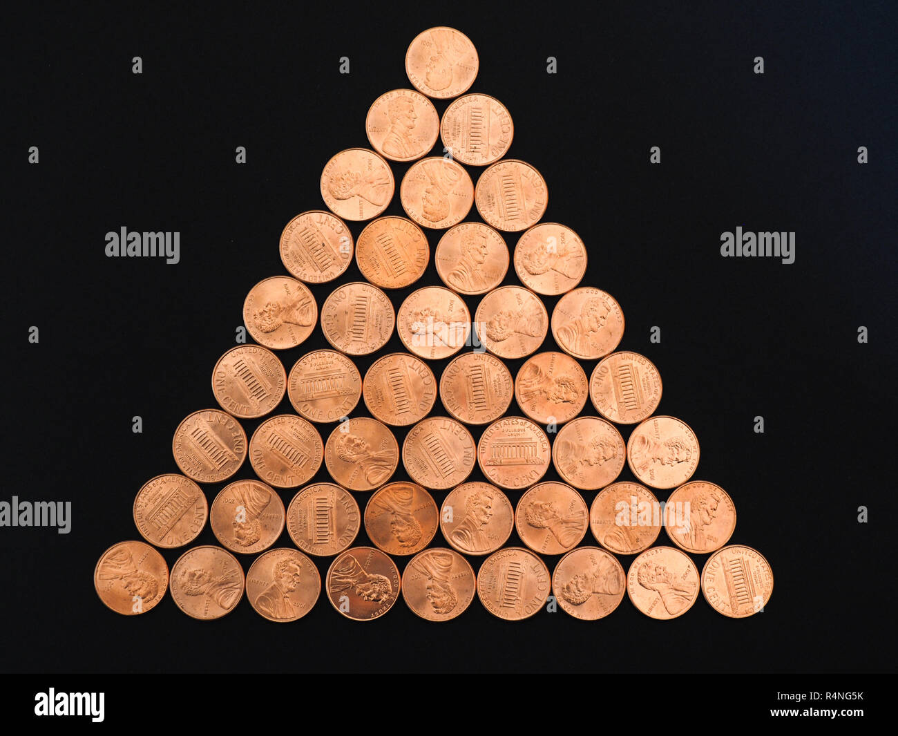 Un centesimo di dollaro monete, Stati Uniti su nero Foto Stock