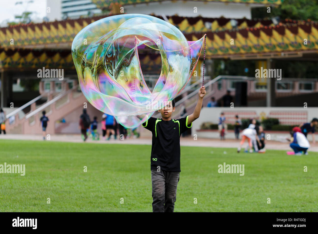 Giocando con bolle Foto Stock