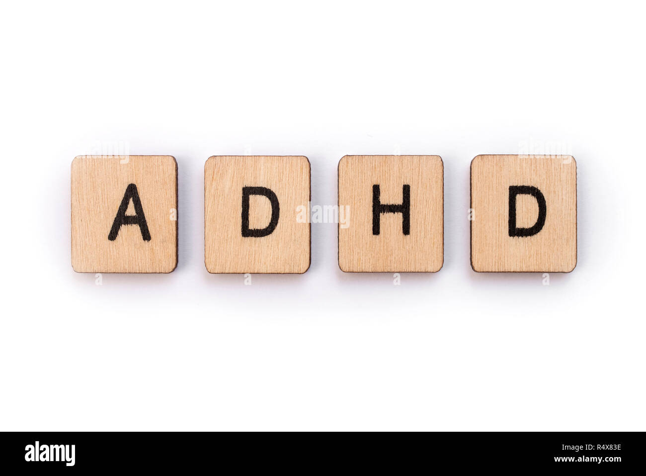 La sigla ADHD - Disturbo da Deficit di Attenzione e Iperattività - il farro con lettera in legno piastrelle. Foto Stock