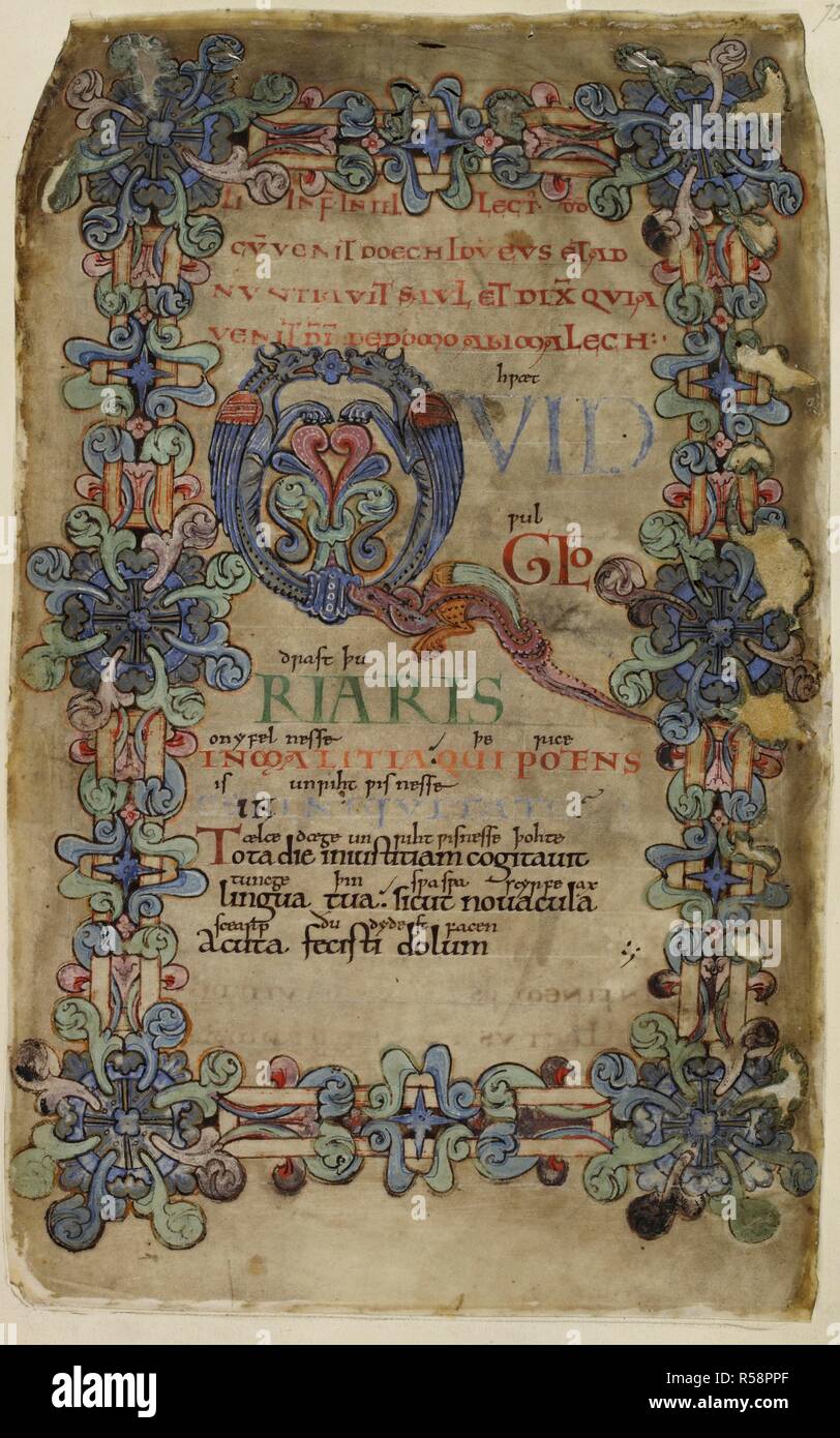 Decorate il testo pagina. Il salmo 51 con iniziale 'Q' formata da due draghi e un terzo dragon formando la coda della lettera. Decorazione di confine di 'Winchester' acanto, con borchie d'angolo. Salterio di Tiberio. Winchester; circa 1050. Fonte: cotone C. Tiberio vi, f.72. Lingue: Latina. Foto Stock