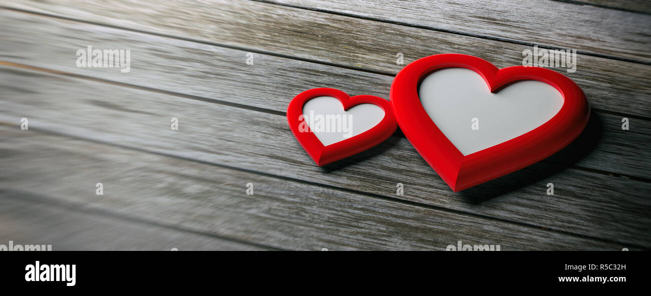 Il giorno di San Valentino, il concetto di amore. Due rosso a forma di cuore cornici vuote su sfondo di legno, banner, spazio di copia Foto Stock