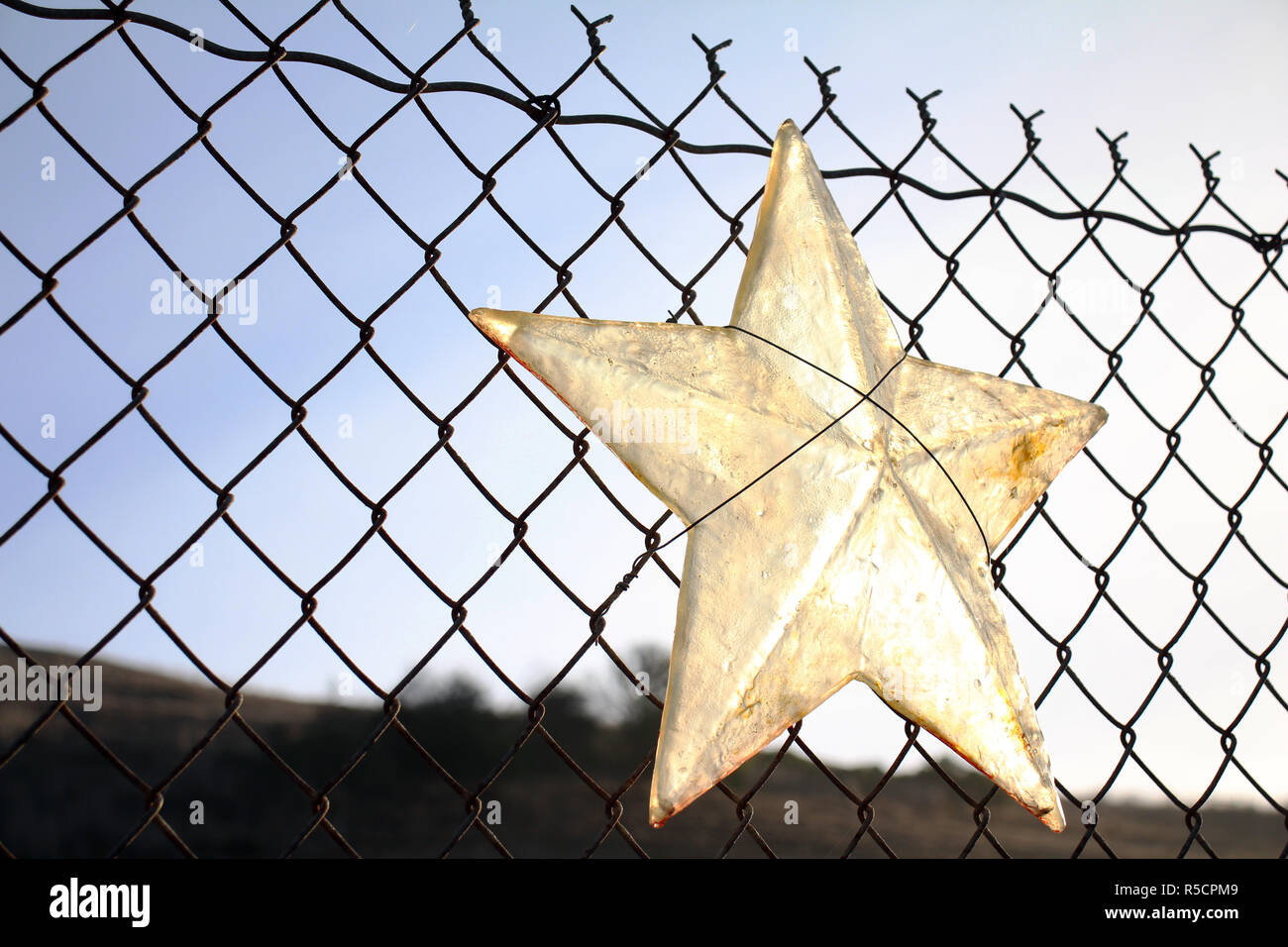 Vetro incandescente stella con sole al mattino Foto Stock