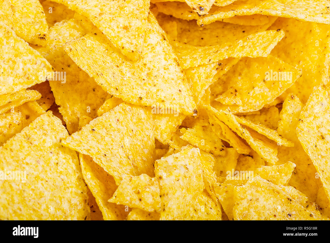 Potato Chips sfondo. Il fast food snack texture. Tortilla chips come una texture e lo sfondo Foto Stock