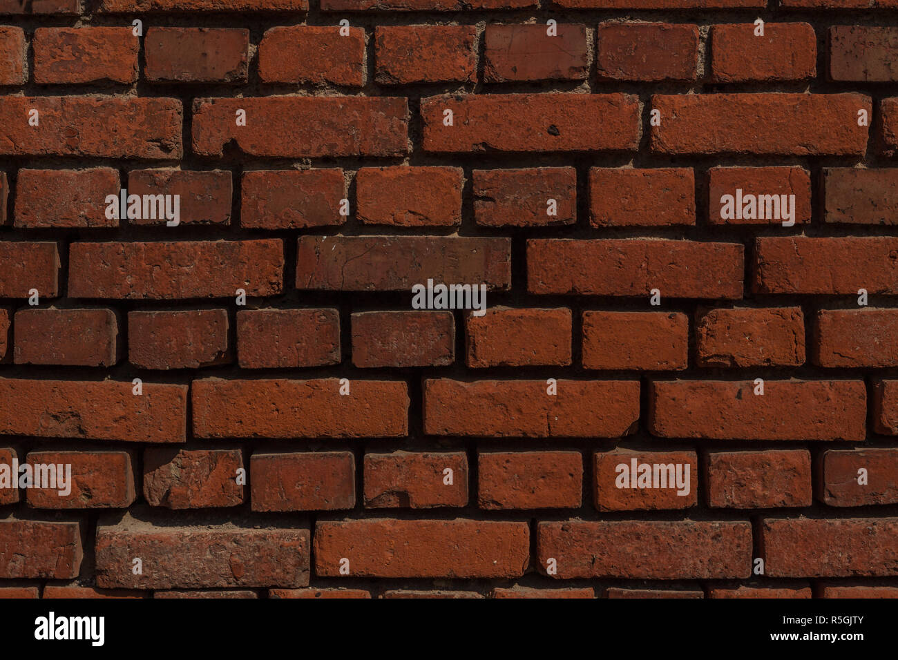 Un muro di mattoni come sfondo Foto Stock