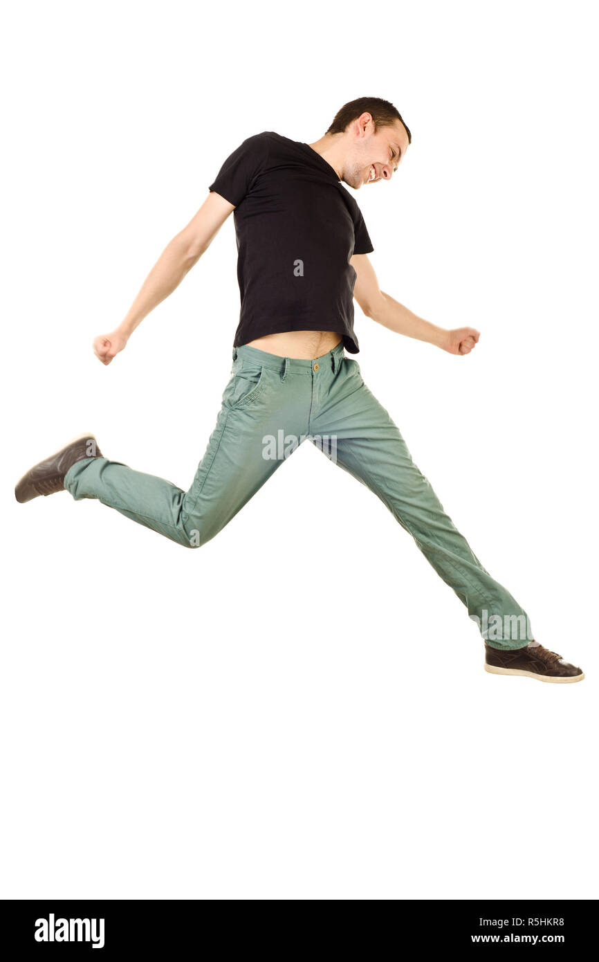 Jumping giovane uomo isolato su sfondo bianco Foto Stock
