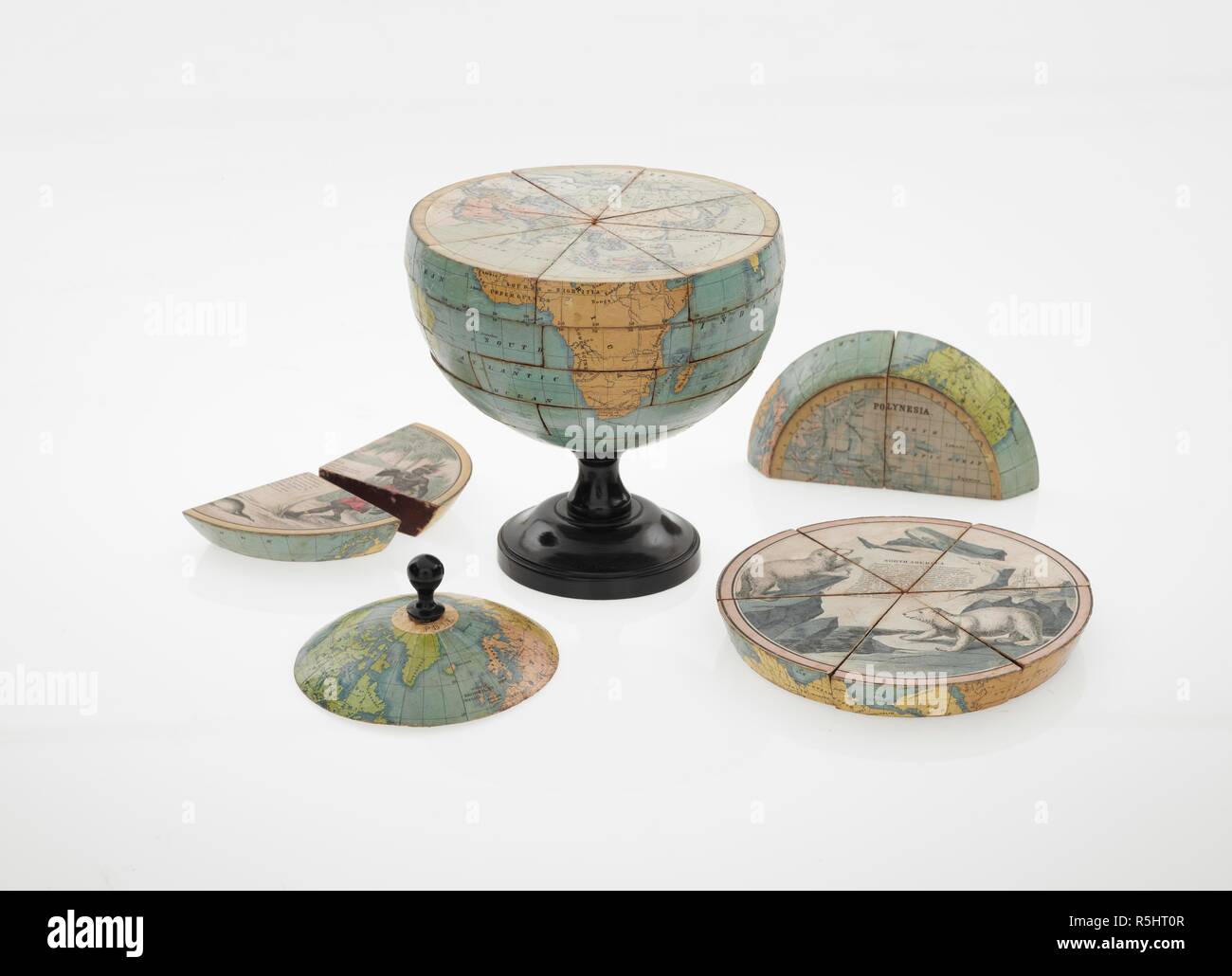 Un dissezionati globe, c.1866. Il dissezionati globo. [Londra?] : [A. & N. Myers?], [1866?]. La forma di segmenti di otto sezioni. Sei di questi visualizza mappe dei continenti sulle loro superfici superiori e le illustrazioni di testo sulle loro superfici inferiori. Descrizione fisica: 1 globo (38 segmenti di legno) : mano col ; 17cm. di diam. Fonte: Mappe G.3 visualizza 3. Foto Stock