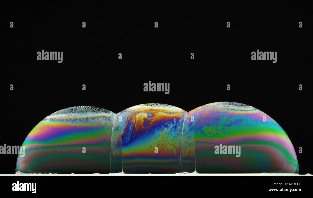 Alcuni di iridescenti bolle di sapone, diffrazione Foto Stock