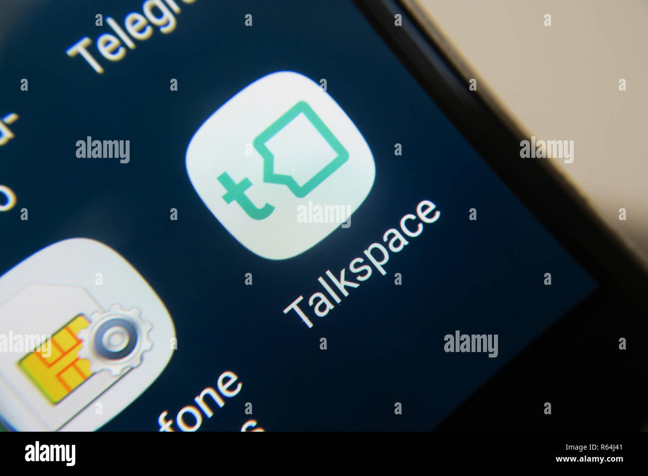 Immagine del Talkspace app su uno smartphone, pulsante Foto Stock