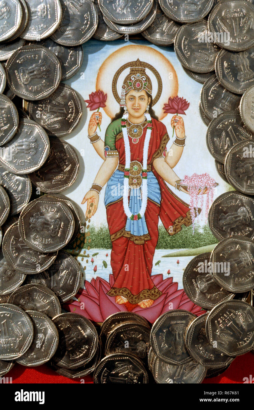 Dea Lakshmi e uno di rupie monete Foto Stock