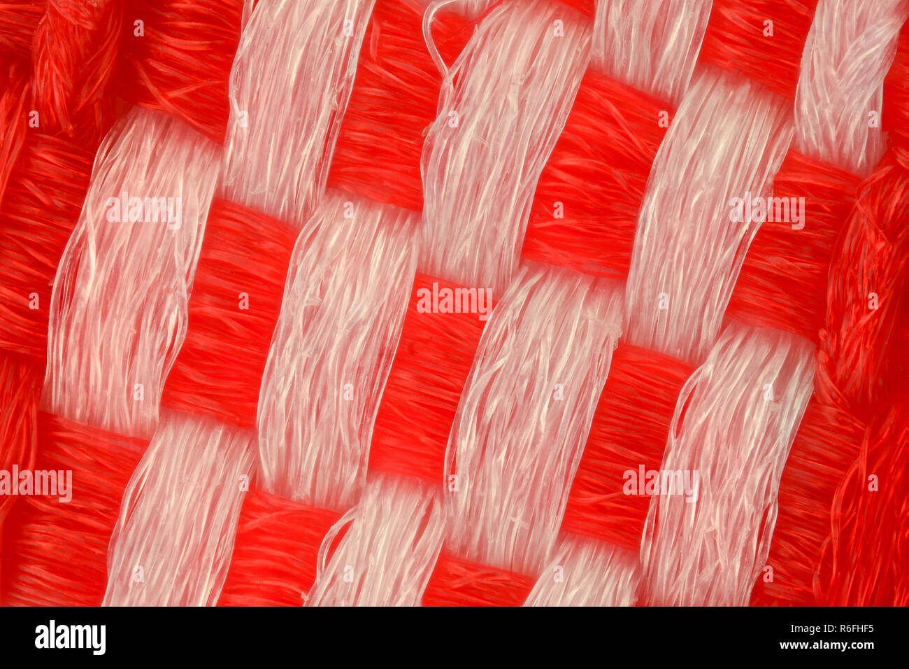 Extreme ingrandimento - rosso e bianco maglia texture di tessuto Foto Stock