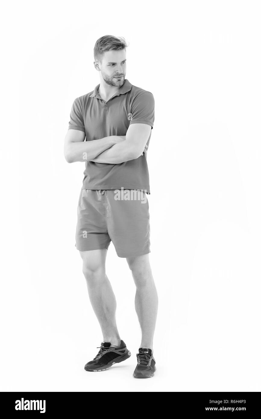Sportsman isolato su bianco. Uomo in active wear e sneakers di lunghezza completa. Personal trainer per uno stile di vita sano. Montare e fiducioso. Sport fashion style. Formazione e attività di allenamento. Foto Stock