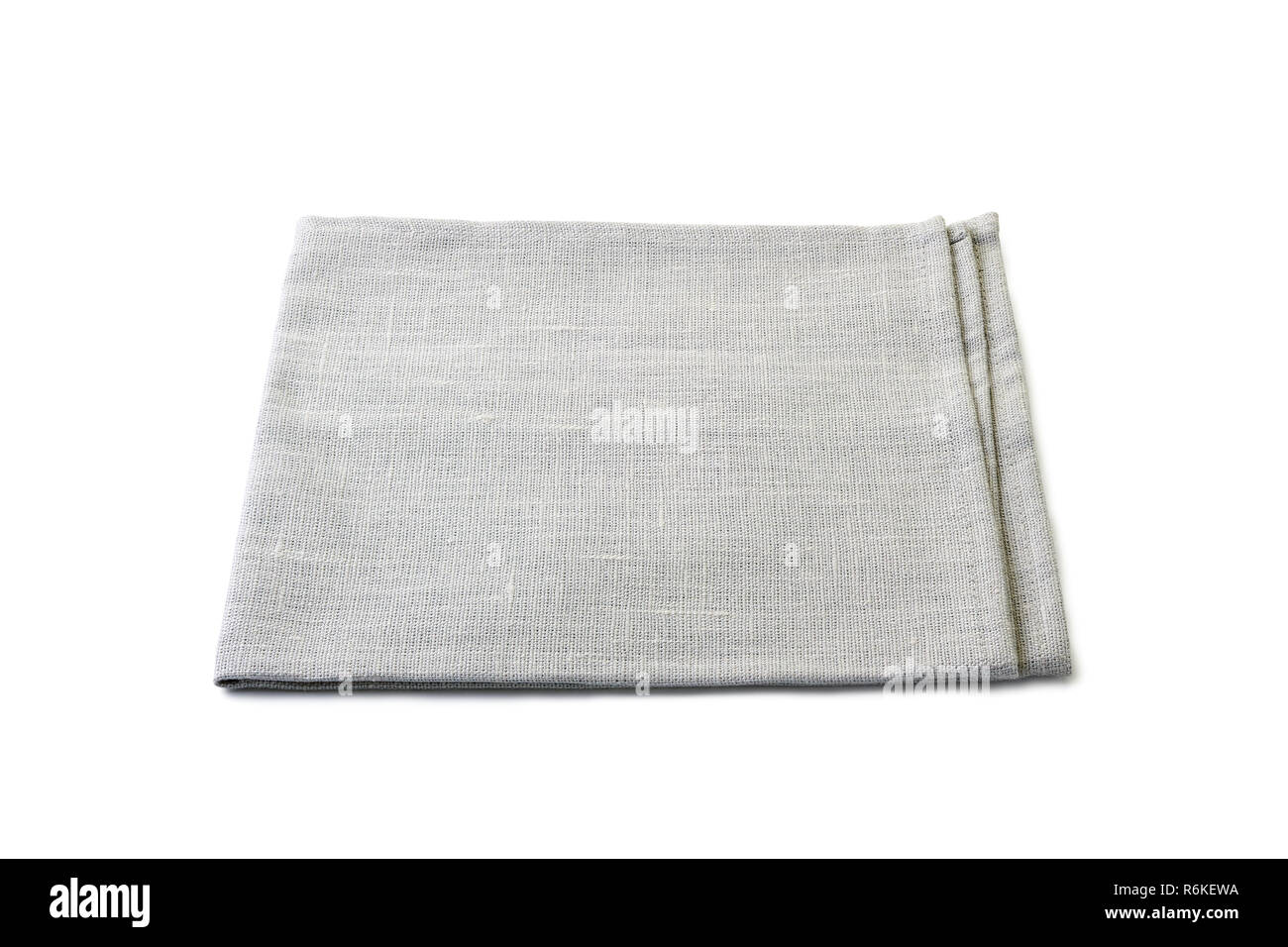 Ripiegate grigio pallido tovagliolo tessili su bianco Foto Stock