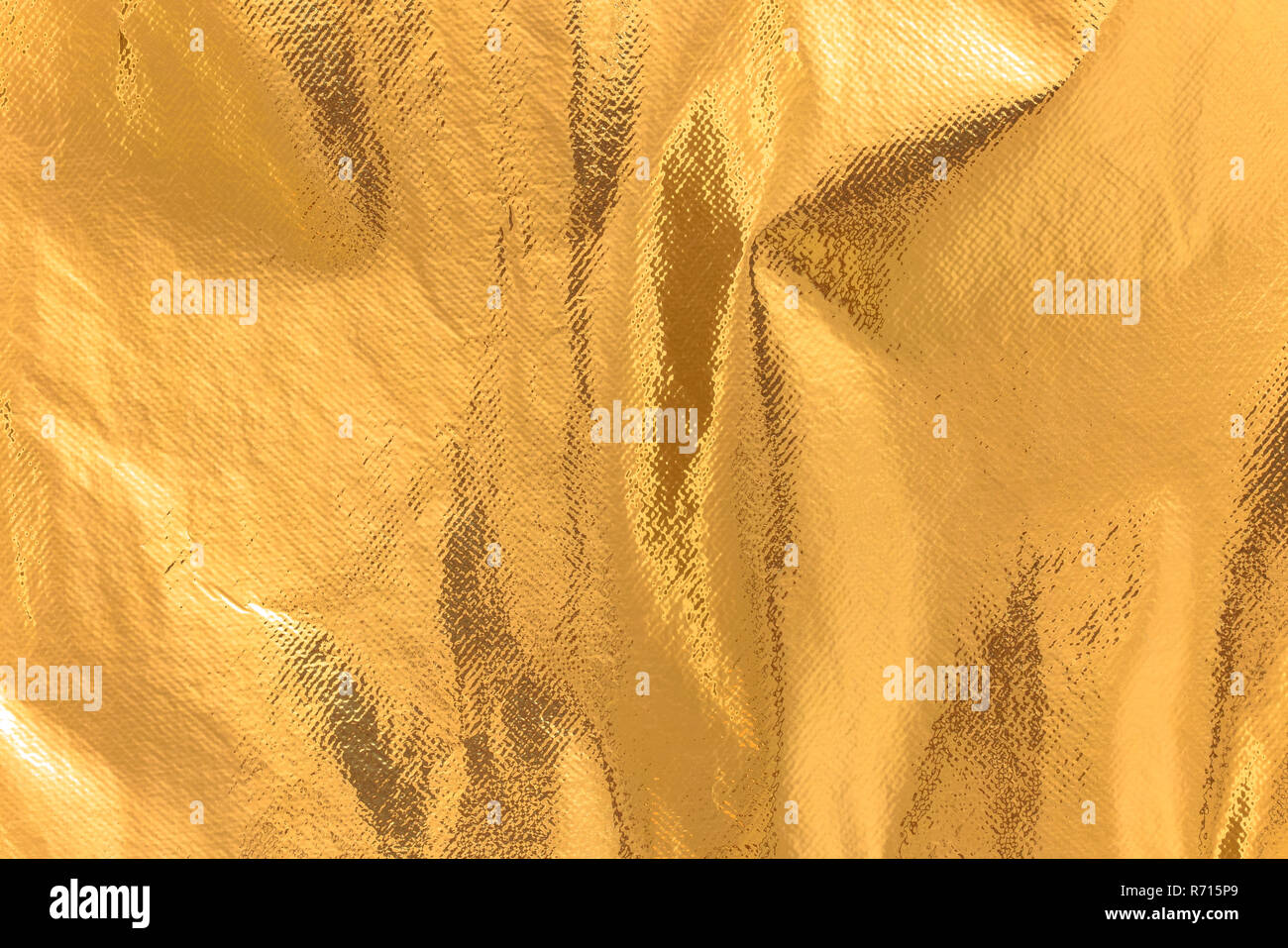 Altamente dettagliate texture di un arrugginito giallo oro scintillante coperta  termica dello sfondo Foto stock - Alamy