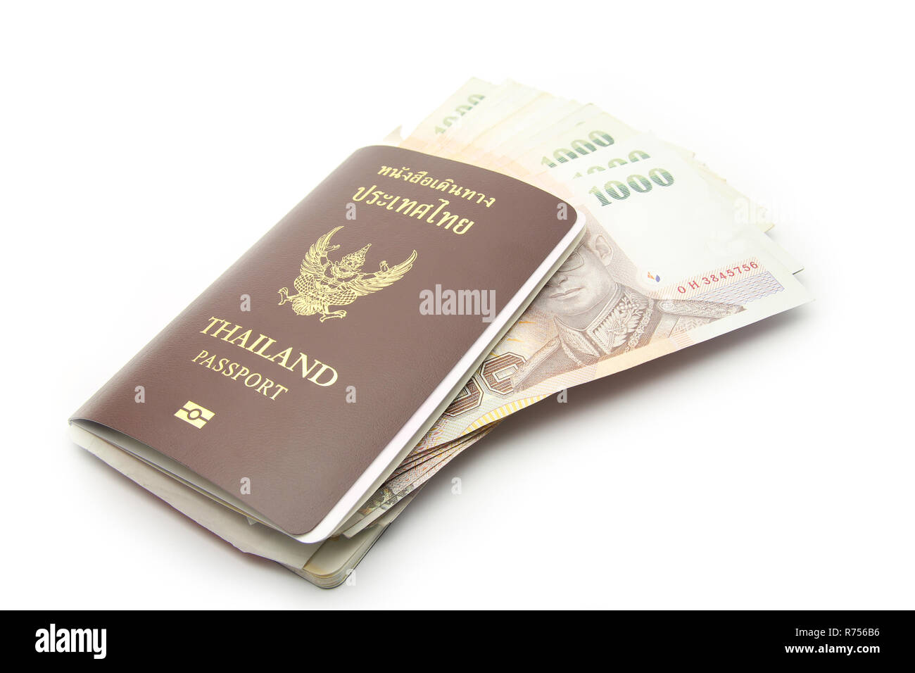Thailandia passaporto con denaro Foto Stock
