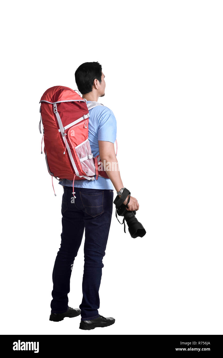 Vista posteriore asian traveler uomo con fotocamera e zaino Foto Stock