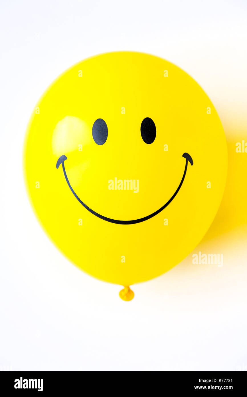 Palloncino, giallo, con cordiale Smiley face Foto Stock