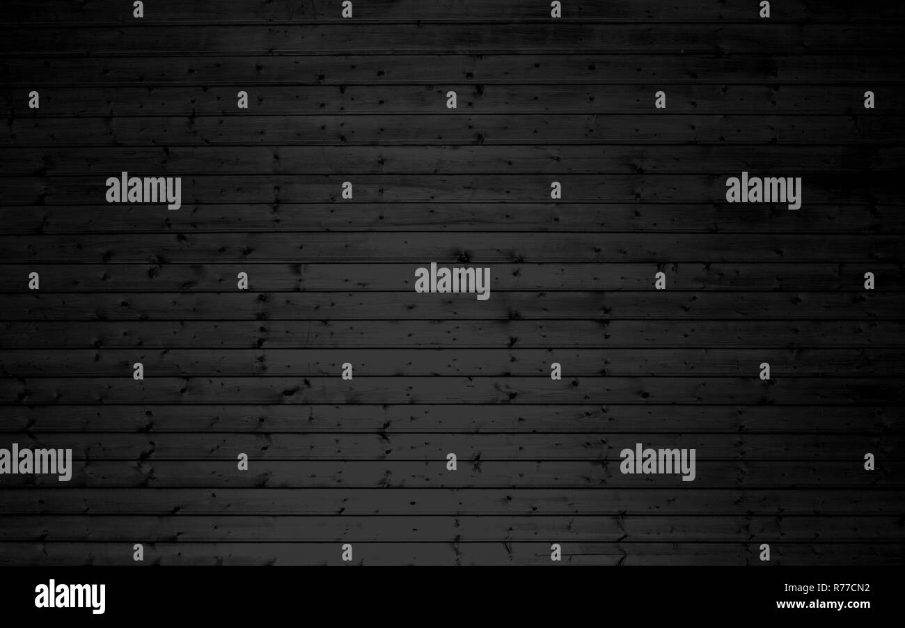 Legno scuro muro con schede di nero Foto Stock