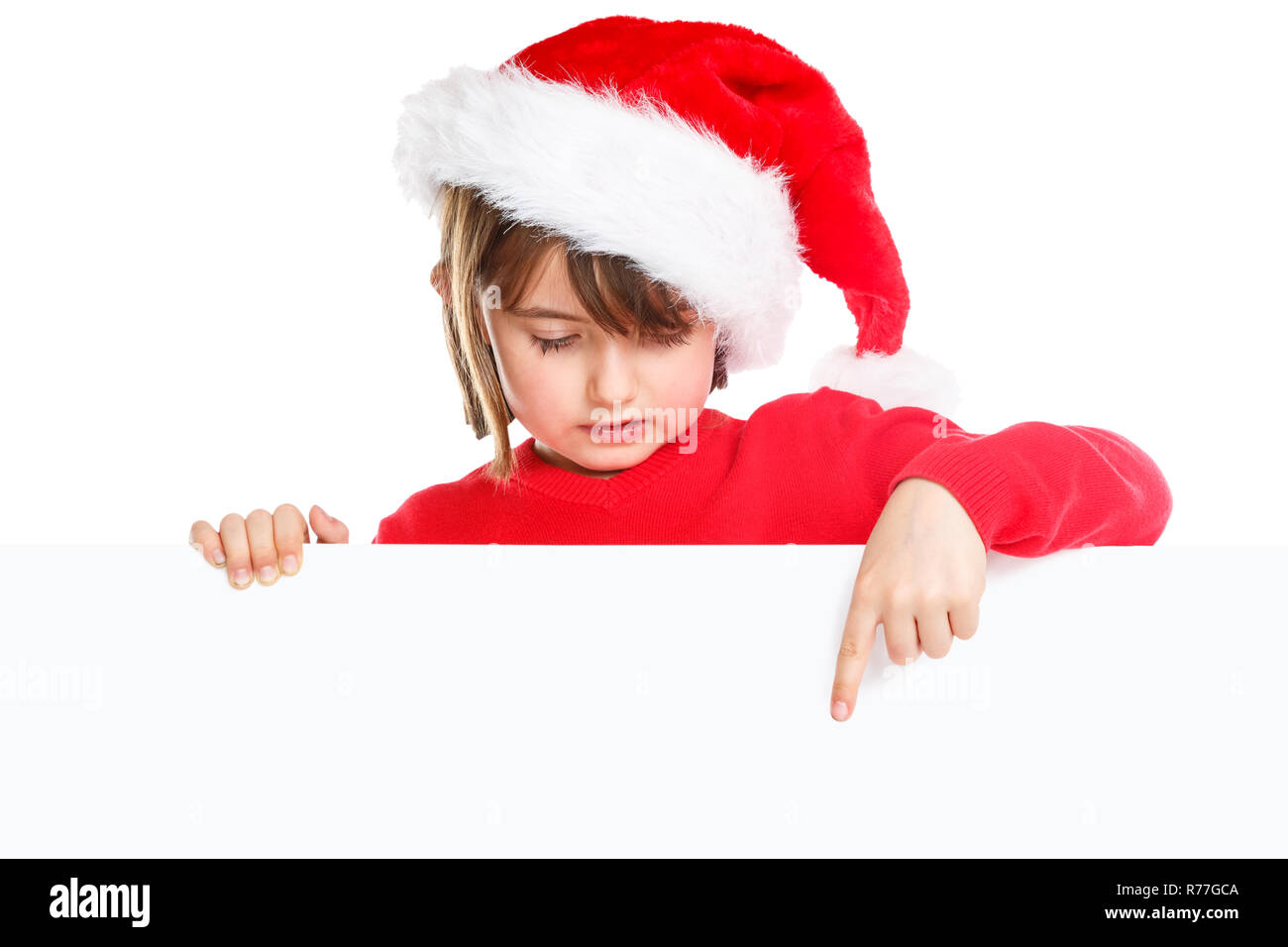 Natale bambino kid girl Santa Claus puntamento banner vuoto copyspace isolato su bianco Foto Stock