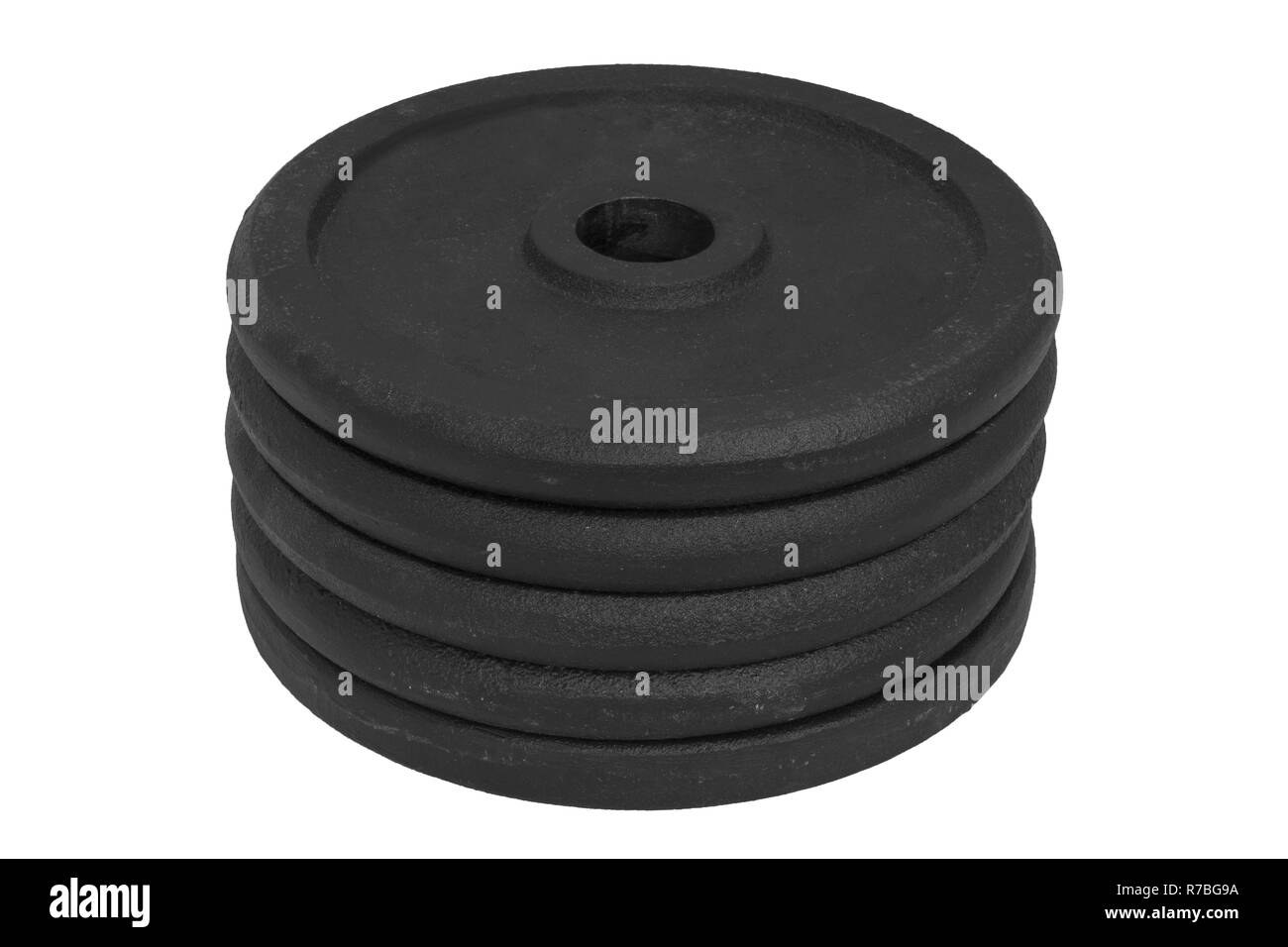 Pila di uguali dimensioni dischi dumbbell isolati su sfondo bianco. Foto Stock