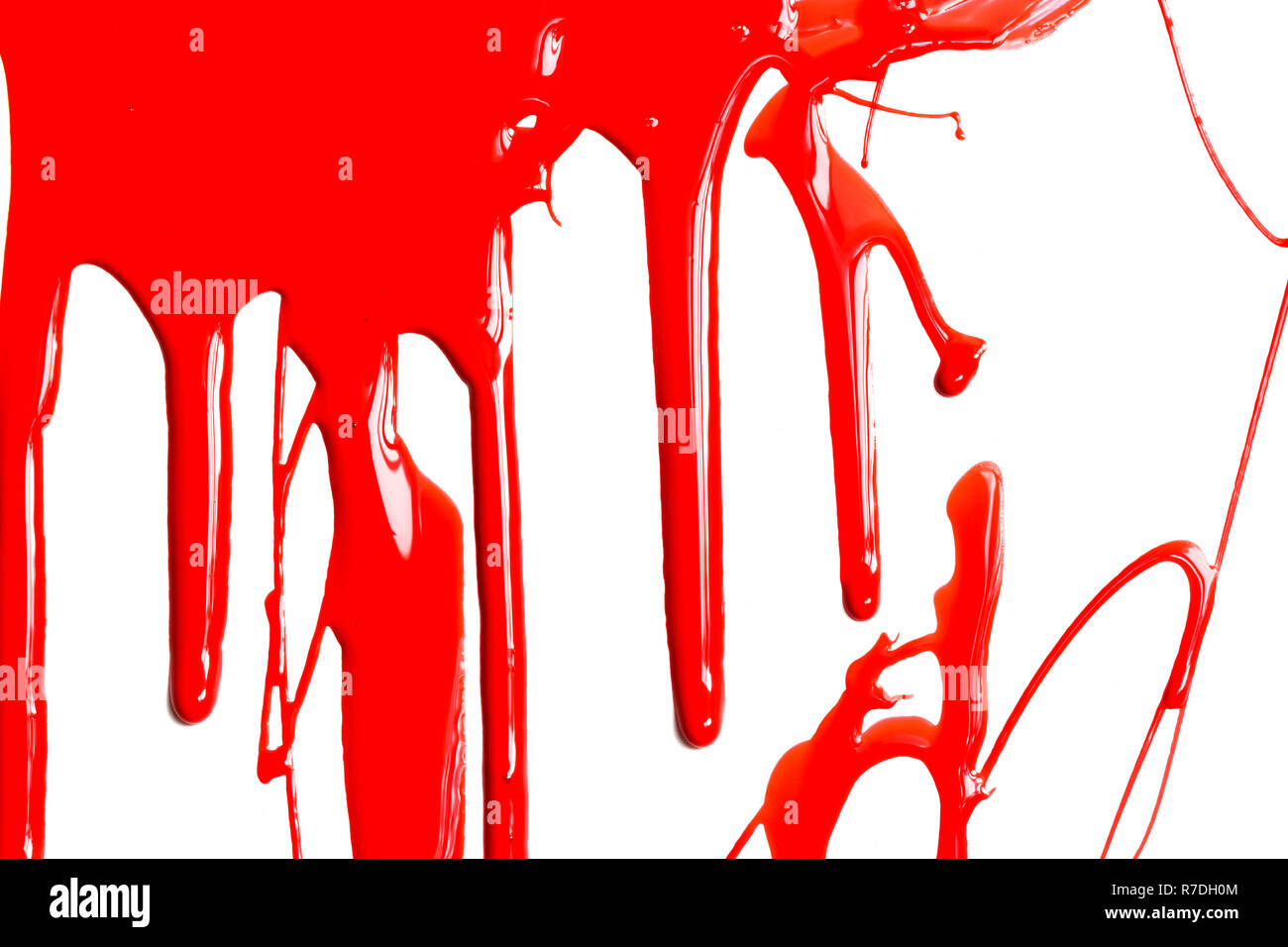 La vernice rossa su uno sfondo bianco Foto Stock