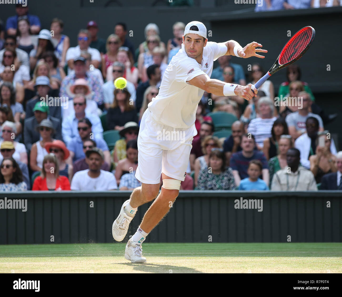 Noi player John Isner in azione a Wimbledon,Londra, Regno Unito. Foto Stock